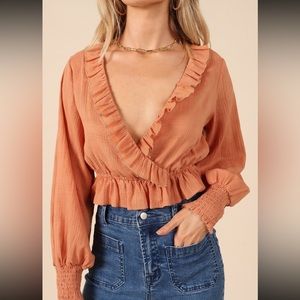 Orange long sleeve crop top